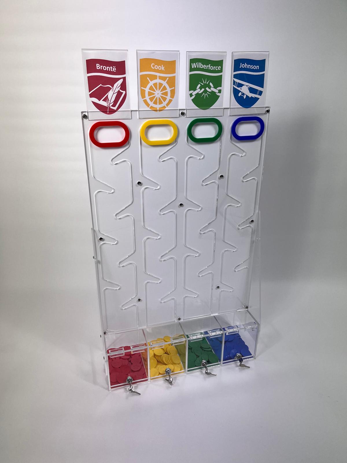 Four-house acrylic reward token unit for UK schools with Bront&euml;, Cook, Wilberforce and Johnson house crests, coloured token handles and lockable house collection drawers